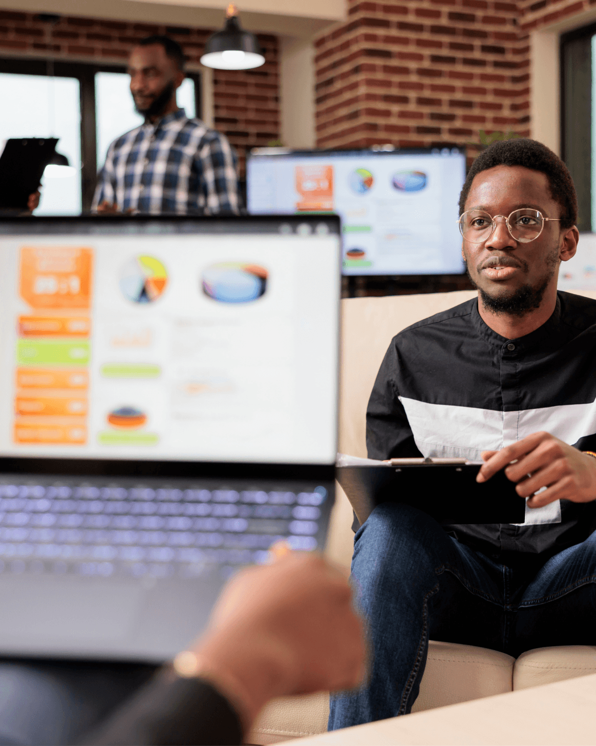 man sitting in front of a laptop